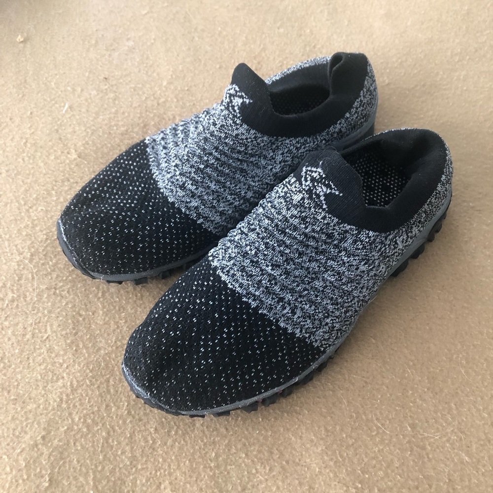 Size 7+ wide slip on mules in black and grey.